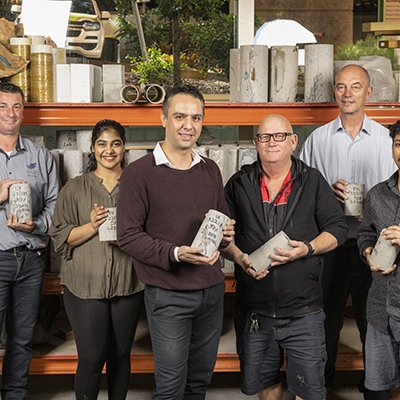 (L-R) GCP Applied Techologies' Niki Jackson, Masters student Sai Manaswi Reddy Basireddy, Dr Mehdi Serati, UQ's Shane Walker, Aurecon's Dr Harry Asche, Masters student Gautam Malgotra in the UQ laboratory